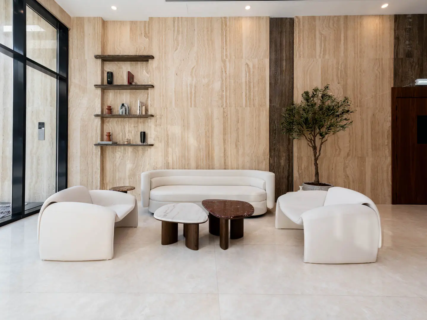 Modern residential entrance lobby at The Spark by Esnaad with upscale finishes and contemporary décor.